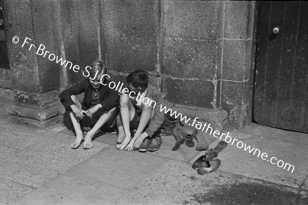 BOYS AT KINGSBRIDGE DRYING FEET